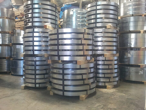 Coils of sheet metal on wooden pallets